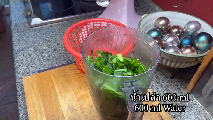 Cut pandan leaves into short pieces and place them in a blender.