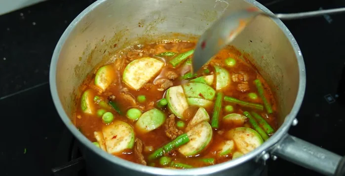 Allow to simmer until eggplant and yardlong beans are cooked. Add young peppercorns.