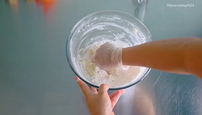Knead and mix the ingredients until a dough forms. Add water if too dry, or more flour if too wet.