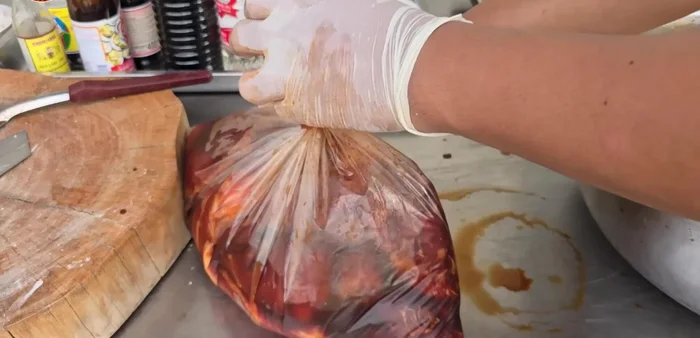 Marinate the pork in the prepared sauce overnight in a bucket of ice.