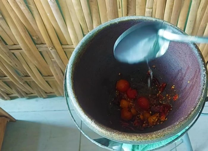 Add palm sugar, fish sauce, tamarind juice (optional), and lemon juice to taste.
