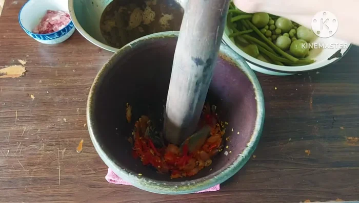 Add the fish sauce mixture to the vegetables. Season with additional fish sauce to taste.