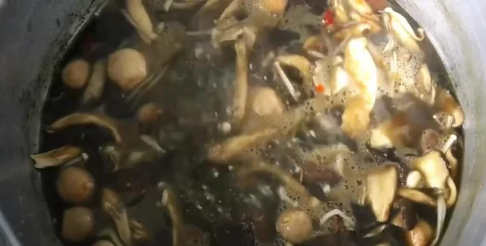 Add cha-om leaves, stir gently, and simmer until fragrant.