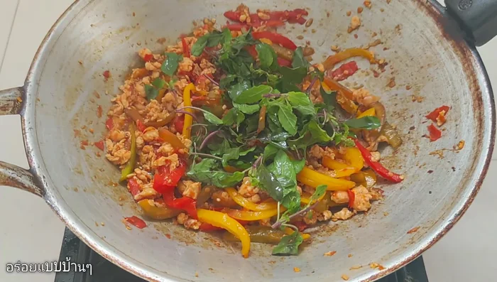 Add basil leaves and stir-fry until wilted and fragrant.