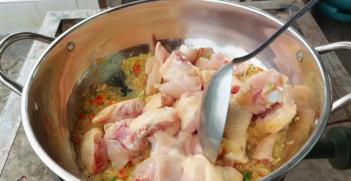 Add chicken and stir-fry until firm, allowing the curry paste to permeate the chicken.