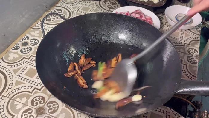 Add the shiitake mushrooms and stir-fry until slightly charred.