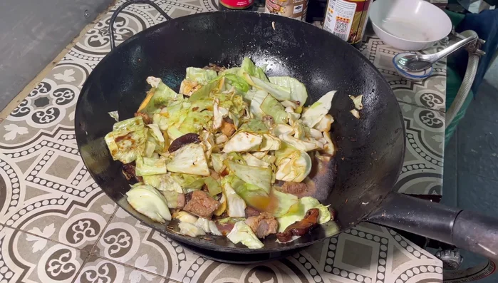 Add 1 liter of water. Transfer to a nabe pot (or continue simmering in the pan) and cover. Simmer for about 30 minutes.