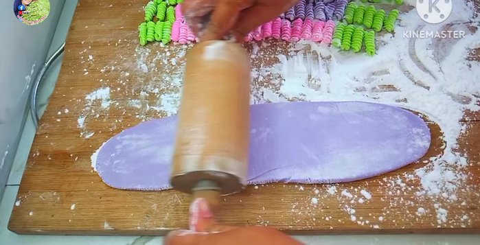 For the Singapore Chendol noodles: Roll the dough into a long, thin sheet, fold it, and cut it into strips.