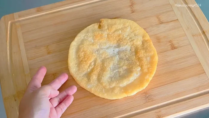 Drain the oil and cut the fried dough into desired shapes.
