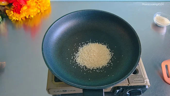 Roast white and black sesame seeds over low heat until they change color. Let them cool.