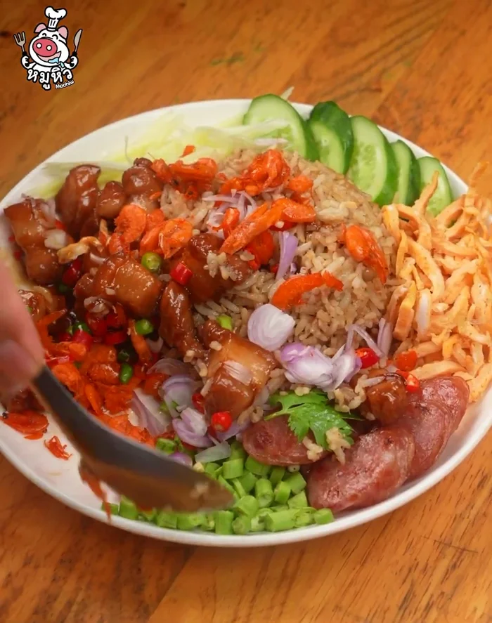 Combine and serve: Combine the cooked pork and fried rice. Serve with prepared side dishes.