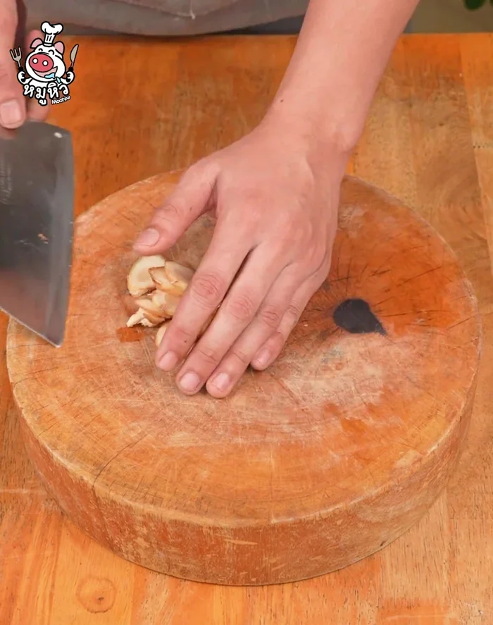 Cut the eggplant in half, then into smaller pieces as desired. Soak in salted water.