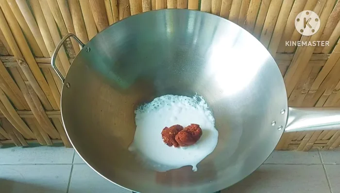 Add coconut milk and then add clean water. Rinse off any coconut milk stuck to the cup.