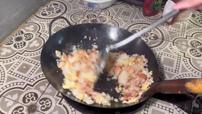 Stir-fry everything together until the rice is coated with the sauce.