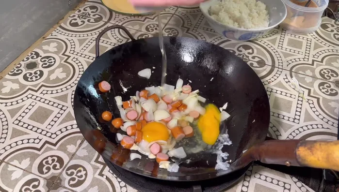Add the eggs and wait for them to set, then spread them with a spatula.