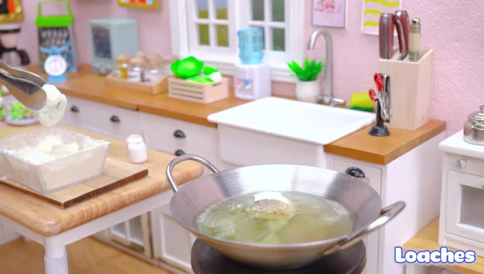 Heat cooking oil and fry the coated catfish until crispy.