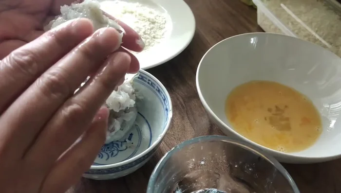 Roll the paste into balls, flatten slightly, and press a small dent in the center. Dip in egg, coat with breadcrumbs (repeat for extra crispy cakes).