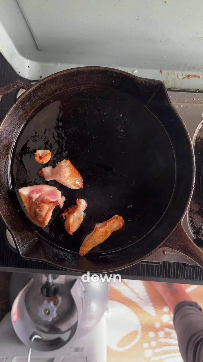 Add duck breasts skin-side down to the pan.