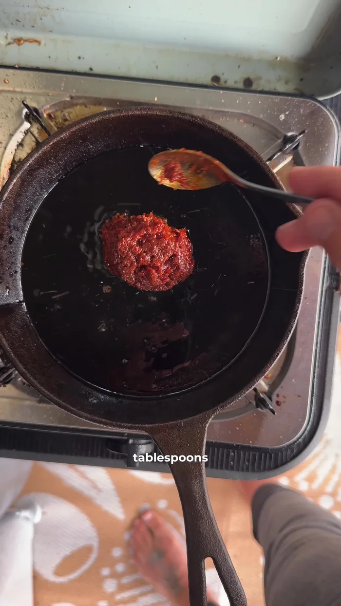 Stir in 2 tablespoons of red curry paste.