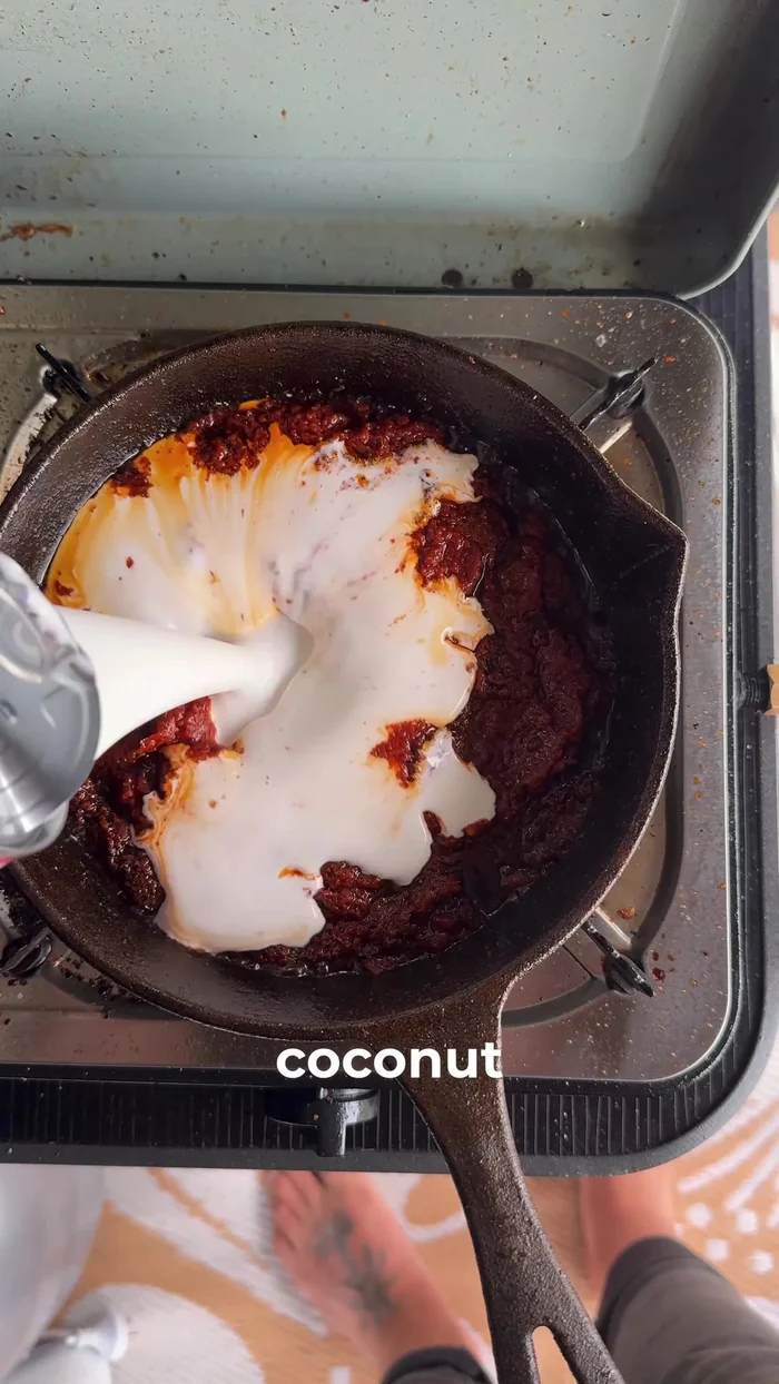 Add coconut cream, 1 tablespoon fish sauce, 1 tablespoon honey, zest of 1 lime, and juice of ½ lime.