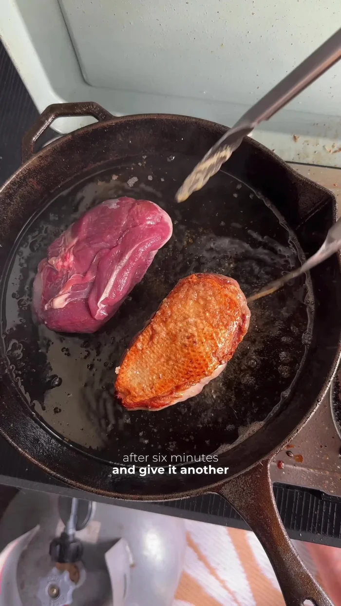 Cook duck breasts for 6 minutes skin-side down, then flip and cook for another 4-5 minutes for medium-rare.