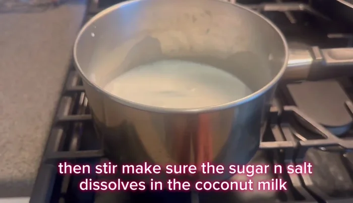 Cook the mixture over low heat until the sugar dissolves and the coconut milk warms up. Stir occasionally.