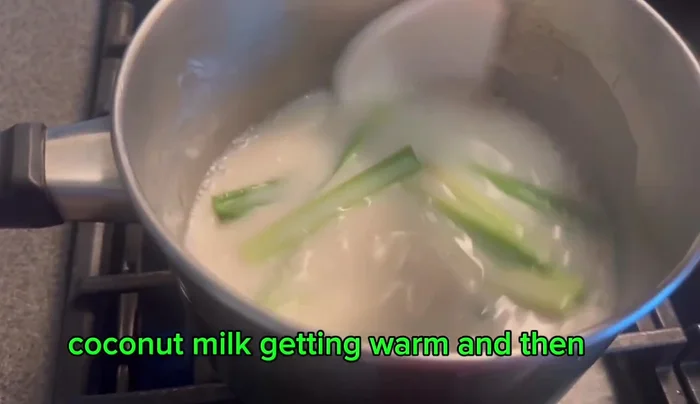Add the prepared banana pieces to the warm coconut milk.