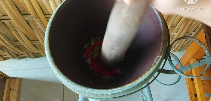 Add the chilies, palm sugar, and MSG (optional) to the mortar and pound until you reach your desired consistency.