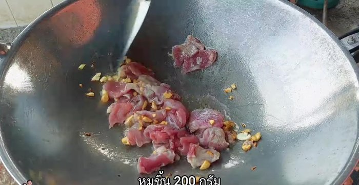 Add the pork and stir-fry until cooked.