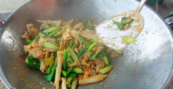 Sprinkle with pepper powder and stir-fry for a few more seconds.