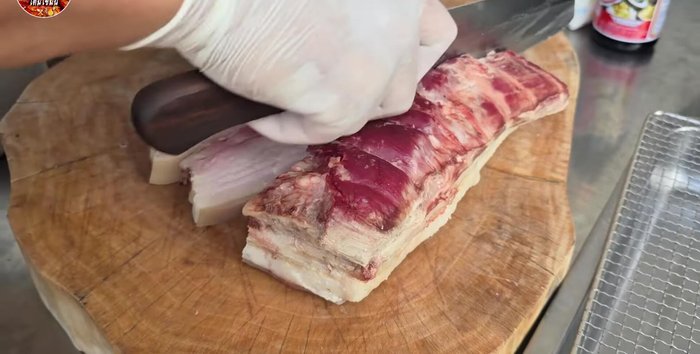Cut the pork belly into slices. It’s easier to cut if it's been frozen for a few hours.