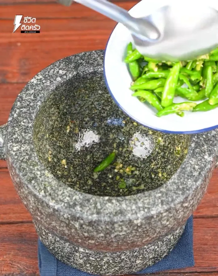 Stir-fry dried chilies in a pan until cooked.