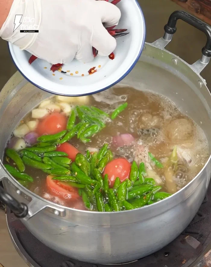 Add coriander, spring onion, and lime leaves. Mix well.