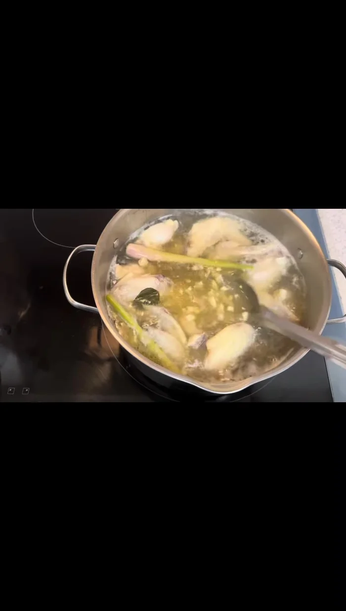 Add a generous amount of garlic, sliced mushrooms, and onions to the broth.