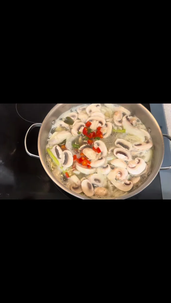 Add chopped Thai chilies (adjust to your spice preference), cilantro, and green onions.