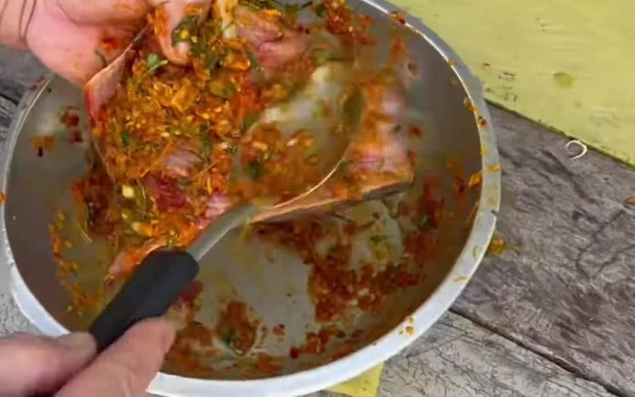 Add the fish pieces to the pot. Gently stir to coat the fish with the curry paste mixture.