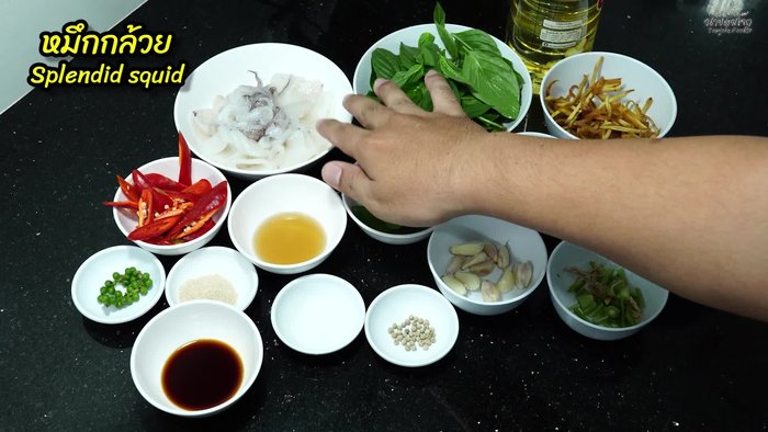 Pound peppercorns and coriander root together to prevent splattering.