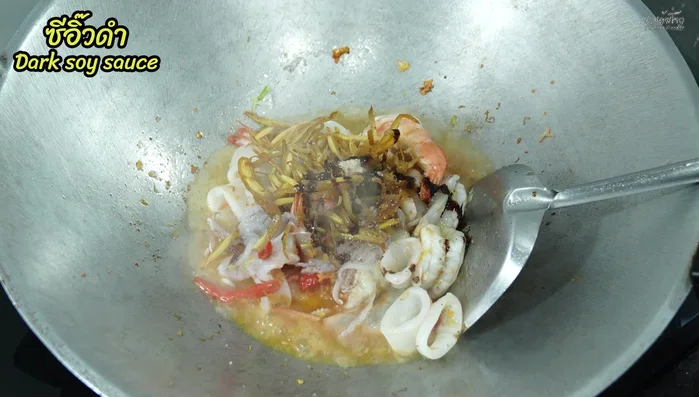 Add a little water (from rinsing the mortar) and black vinegar for color and flavor.