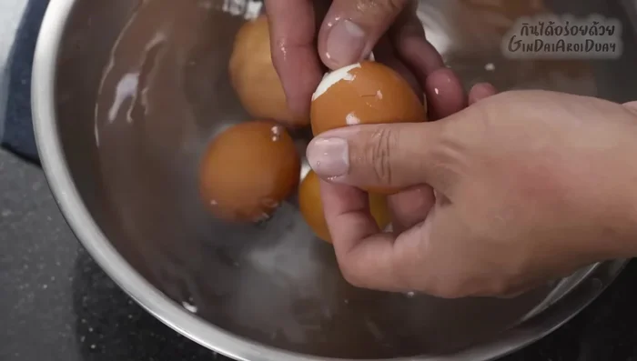 Peel and chop boiled eggs.