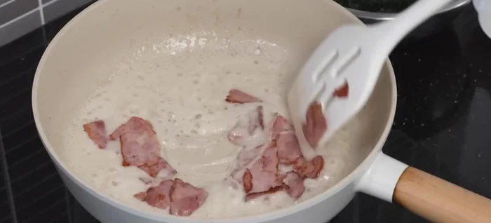 Stir in the cooked bacon.