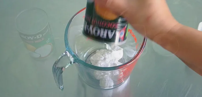 Prepare the coconut milk topping: Mix coconut milk, sugar, salt, and rice flour in a bowl.