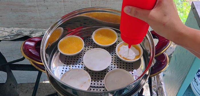 Pour the coconut milk topping over the cooled cassava dessert.