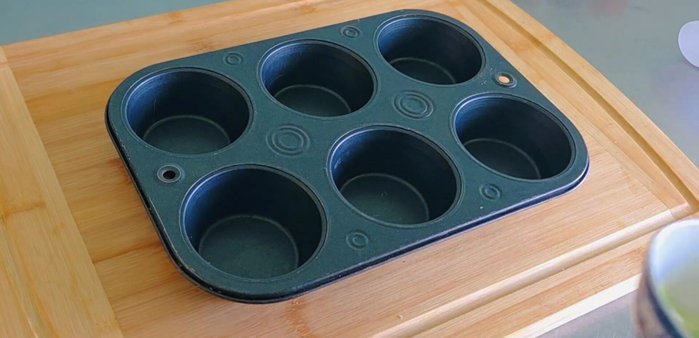 Place the pastry pieces in a greased baking tray.