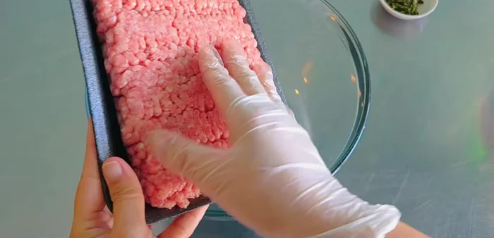 Grind the pork. If buying pre-ground, skip this step.