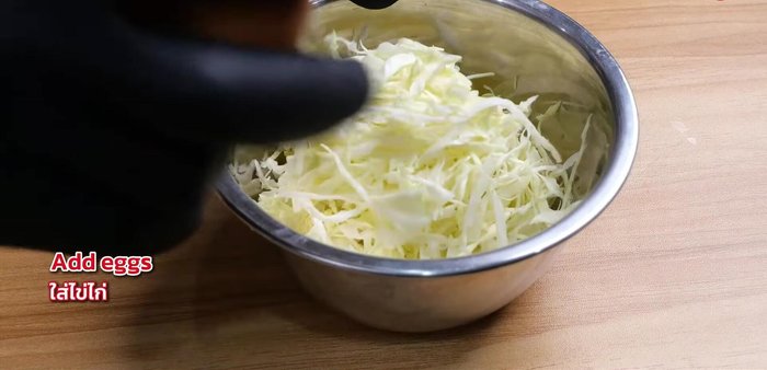 Prepare the cabbage. (Detailed preparation method not available from transcript)