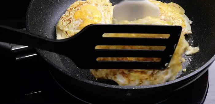 Crack eggs into the pan on top of the cabbage.