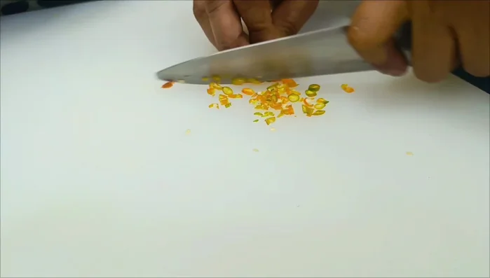 Finely chop the fresh red chili.