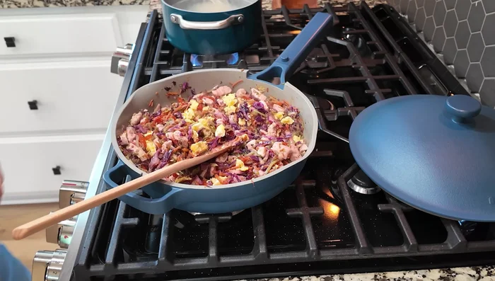 Pour the sauce over the noodles and vegetables. Mix well.