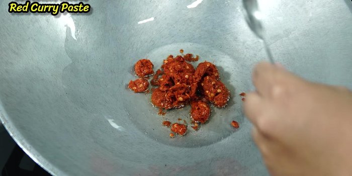 Add curry paste and shrimp paste; stir-fry until dissolved.