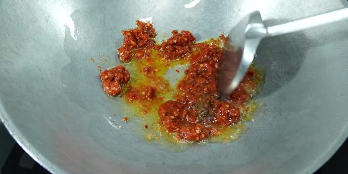 Add yellow onion and stir-fry until fragrant.